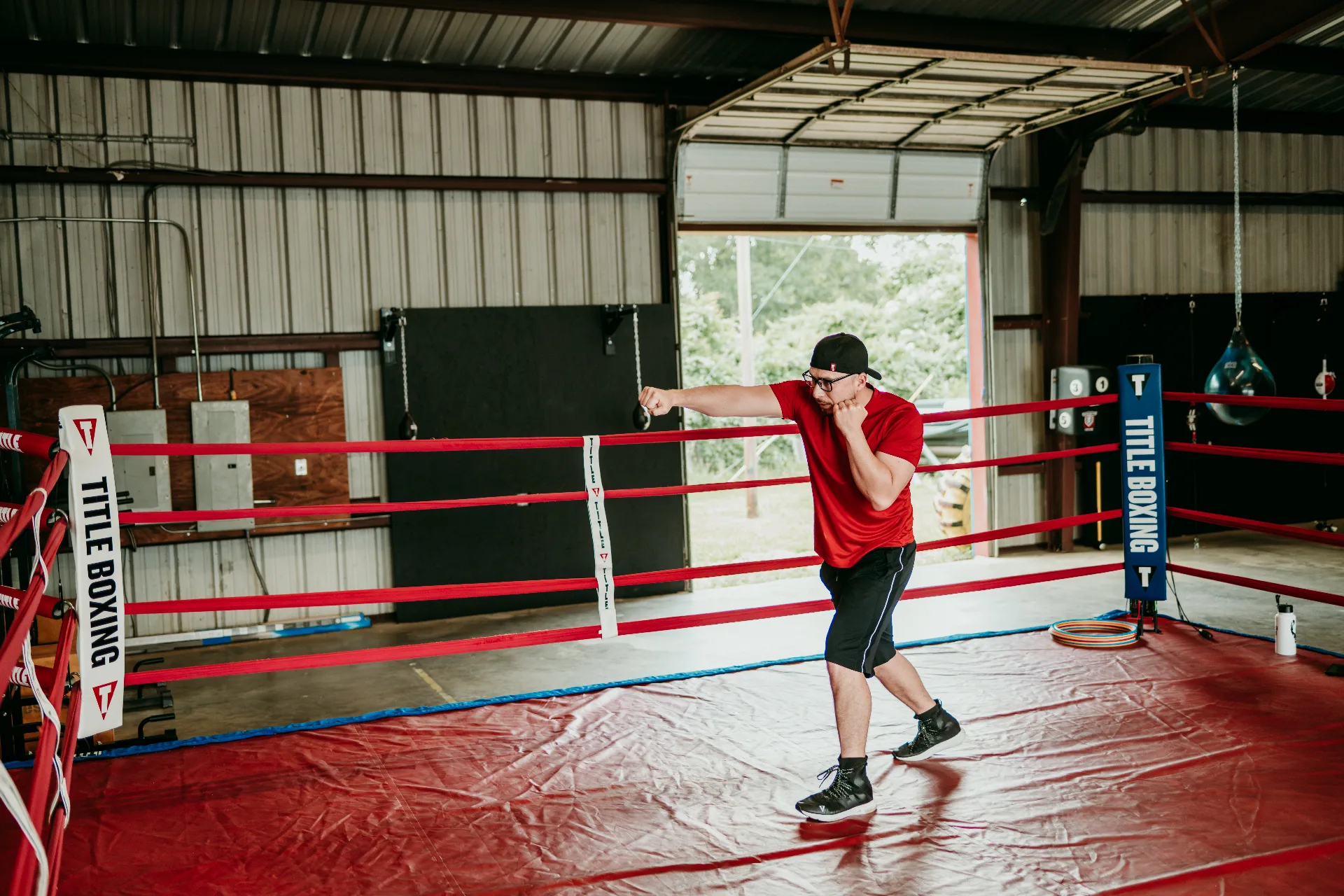 Coach Romo shadowboxing inside the ring at One More Round Boxing Gym